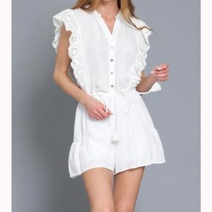Adorable, flirty white romper with lace details. Perfect for summer!